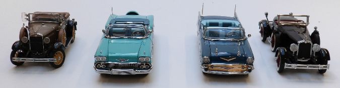 Four Danbury Mint diecast model cars comprising 1931 Ford Model A Roadster, The 1927 Stutz Black