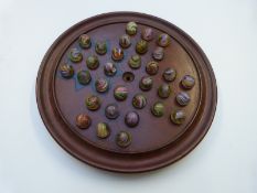 Thirty-two handmade glass marbles all with multi-coloured latticino and spiralling decoration,