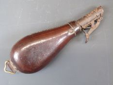 Brown leather shot flask with sprung catch and suspension loop, 20cm long