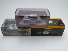 Three 1:18 scale diecast model cars comprising Minichamps Car Collection limited edition Morris