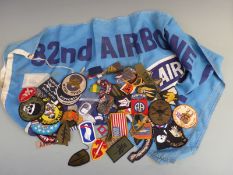 A collection of WWII and later US military insignia, flag, medals etc
