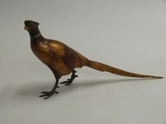 A cold painted bronze / metal figure of a pheasant,, in the manner of Bergmann. Impressed mark