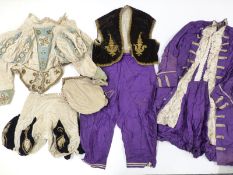 Child's purple frock coat and pantaloons with an early collared velvet outfit in the Jacobean