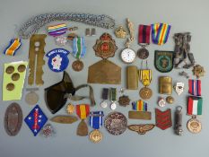 Quantity WWI and WWII medals, badges including hallmarked machine gun corps, trench art etc