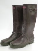 A pair of brown Hunter Wellington boots with neoprene lining, size 9.
