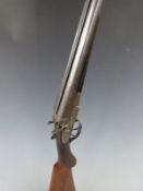Charles Boswell 12 bore side by side hammer action shotgun with all over scrolling engraving,