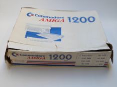 Commodore Amiga 1200 in original box together with various games