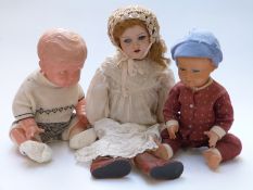 Three vintage dolls comprising a hard plastic example marked to the back K and Made in Japan, 54cm