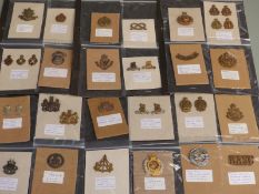 A collection of British Army cap badges / collar badges including the South Irish Horse, The