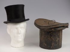 Silk top hat with letter as to where it was found, date 1886, size 6 7/8, in original tin case.