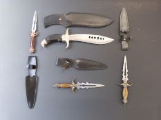 Four decorative knives largest with eagle decoration. Handle and blade length 22cm.