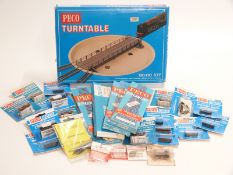 Twenty-eight PECO and similar 00 gauge points, motors, turntables etc, all in original boxes/