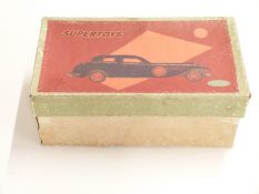 Supertoys clockwork tinplate car with blue body, red and yellow decoration, red hubs and opening