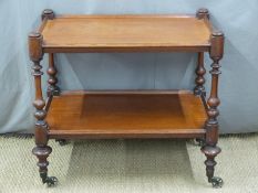 A 19thC mahogany two tier drinks or similar trolley raised on brass castors, L83 x D50 x H76cm