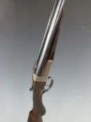 George Bate 12 bore side by side ejector shotgun with gold named lock, all over scrolling engraving,