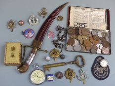 A small collection of badges, coins, Indian knife etc