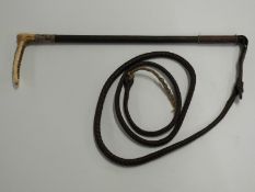 A driving whip with a hallmarked silver collar by Swaine & Adeney