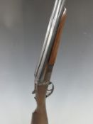 Zabala 12 bore side by side shotgun with named lock, chequered grip and forend and 26 inch