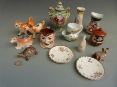 A collection of ceramics and glassware including Murano style vase, Japanese urn, cow creamers,