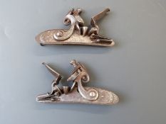 Pair of Bennett flintlock gun locks with ornate engraving to the named side plates and scrolling