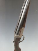 Charles Boswell 12 bore side by side shotgun with named locks, all over fine scrolling engraving,