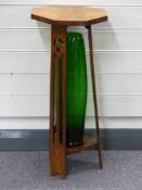 Art Nouveau octagonal side table with green vase, height 68cm