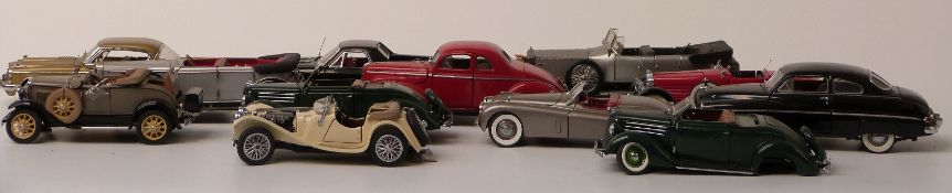 Twelve Franklin and Danbury Mint diecast model cars including Jaguar, Chevrolet, Ford, Studebaker
