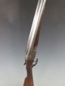 BSA 12 bore side by side shotgun with named lock, double trigger, raised ball sight and 30 inch