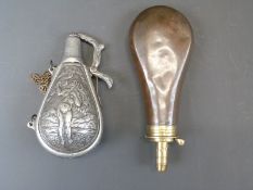 Sykes copper and brass powder flask (20cm long) together with another of bulbous form embossed