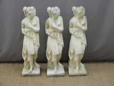 Three garden statues of semi nude ladies, height 80cm