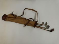 Vintage golf clubs including Spaldings Halley in canvas bag.