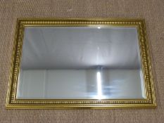 Bevelled glass mirror, overall size 66 x 95cm