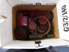 A collection of Meccano motors, wheels, gears and parts, some in original boxes