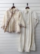A nightgown with lace trim and an open jacket with embroidered edging