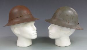 Two WWII British helmets, one with label Town Clerk, Poplar Town Hall, London E8