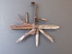 A 19thC steel and deer horn coachman's knife / multi tool with engraved decoration, the tools