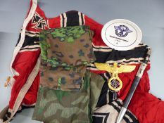 A quantity of reproduction WWII Nazi German flags, bayonet uniform etc