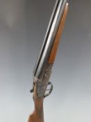 Armas Bisonte 12 bore sidelock side by side shotgun with engraved scenes of dogs and birds to the