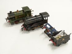 Two Hornby 0 gauge clockwork locomotives comprising GWR 0-4-0 tank loco and a BR 0-4-0 60199