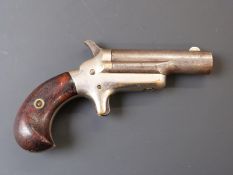 Colt No. 3 .41 rimfire derringer pistol with shaped grip, nickel plated frame, sheathed trigger