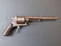 Belgian 8mm six-shot centre fire revolver built on a pinfire frame with shaped wooden grips, folding