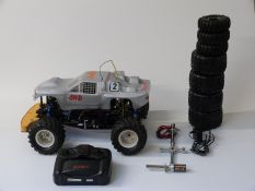 Tomahawk 4WD Off-Road Racer remote controlled nitro buggy with spare wheels, two starters and
