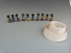 Ten Robertson's golly figures including seven bandsmen and three footballers together with nurse's