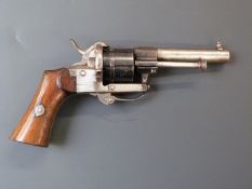 Belgian 7mm pinfire six-shot double action revolver with shaped wooden grips, folding trigger and