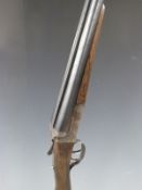 Pioneer 12 bore side by side shotgun with engraved lock, chequered grip and forend and 28 inch