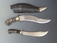 Two inlaid kukri, one in scabbard, largest 43cm