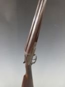 Army & Navy 12 bore side by side shotgun named and engraved locks, finely engraved underside,