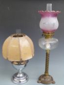 Two oil lamps, one marked Bamford, England, tallest 70cm