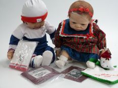 Two The Ashton-Drake Galleries dolls Merry Christmas, Emily, 50cm tall, and Ryan, The Little