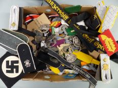 A quantity of WWII Nazi German medals, badges and cap insignia including tinnies